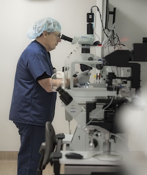 Faculty Douglas Raburn, PhD, director of the Assisted Reproductive Technology Laboratories at Duke Fertility Center, in the embryology lab. His research focuses on gamete, embryo and reproductive tissue biology.