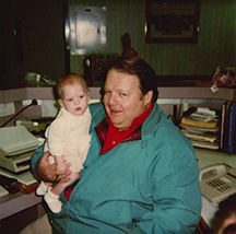 Doctor holding baby.