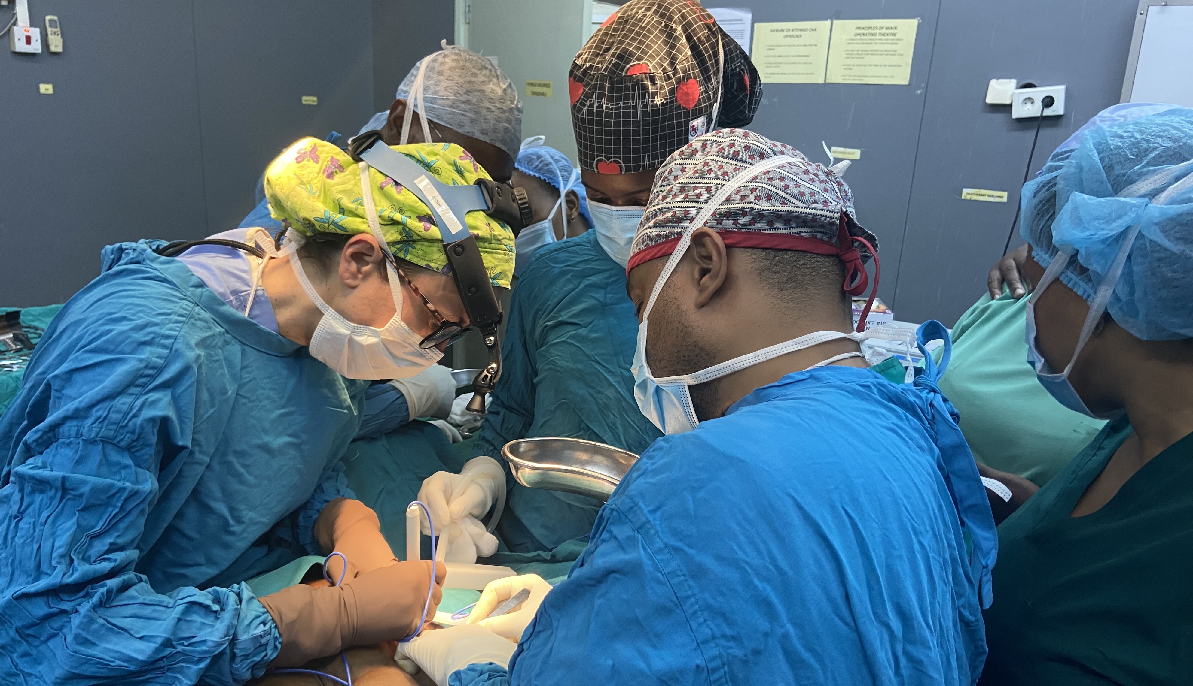 Surgeons operating on a patient