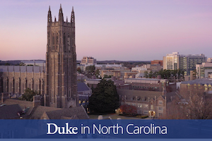 Duke Chapel tower and campus buildings at dusk.