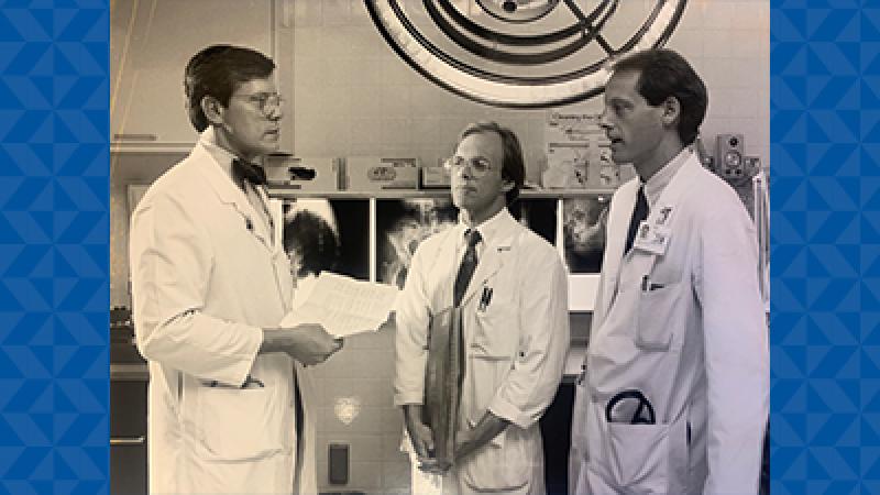 Dr. Creasman talking to colleagues.