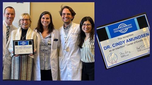 Group of urogynecologists with award