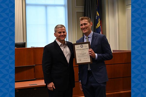 NC Attorney General Josh Stein presents Dogwood Award to Dr. Jonas Swartz