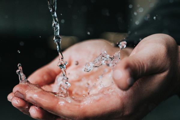 Hands with splashing water