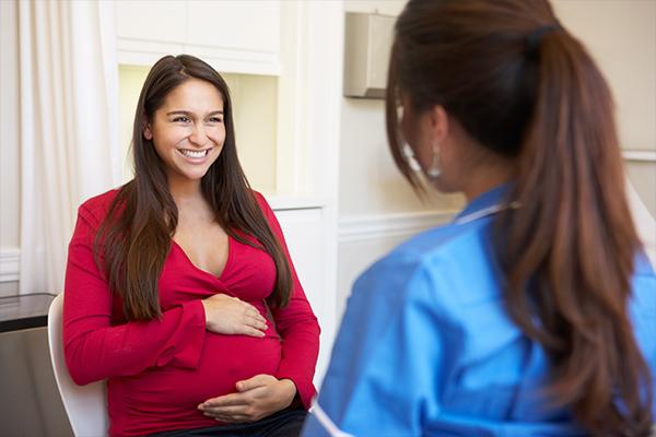 Pregnant patient in red shirt