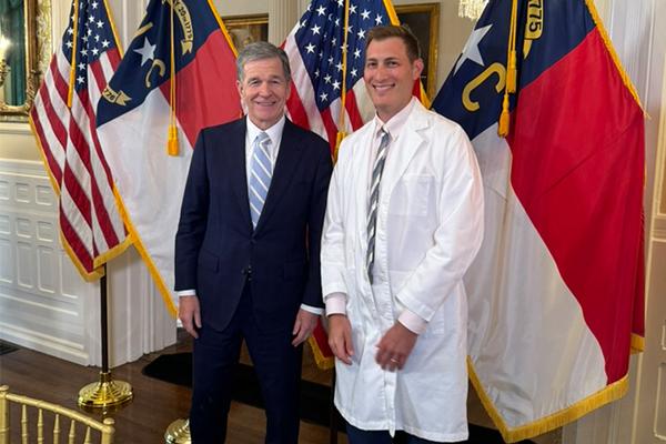 Gov. Roy Cooper with Jonas Swartz, MD, MPH