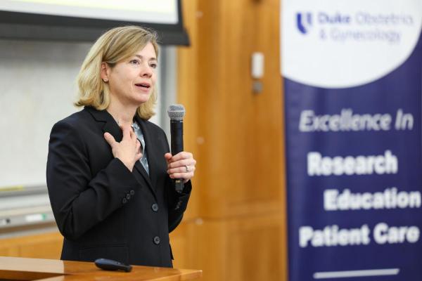 Catherine S. Bradley, MD, MSCE, talking at podium.
