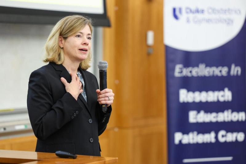 Catherine S. Bradley, MD, MSCE, talking at podium.