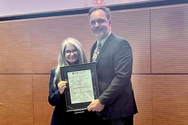 Dr. Craig Sobolewski being presented with award.