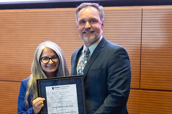 Dr. Craig Sobolewski being presented with award.