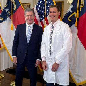 Gov. Roy Cooper with Jonas Swartz, MD, MPH