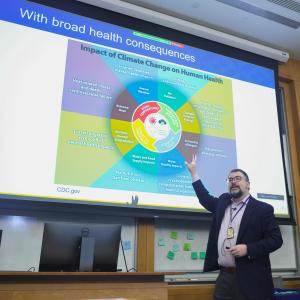 Dr. Robert Tighe presenting a slide at Climate Action Day.