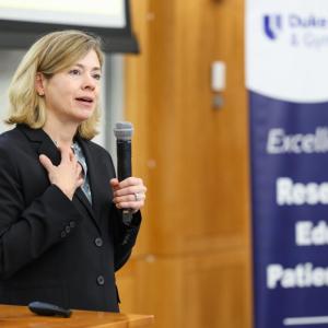 Catherine S. Bradley, MD, MSCE, talking at podium.